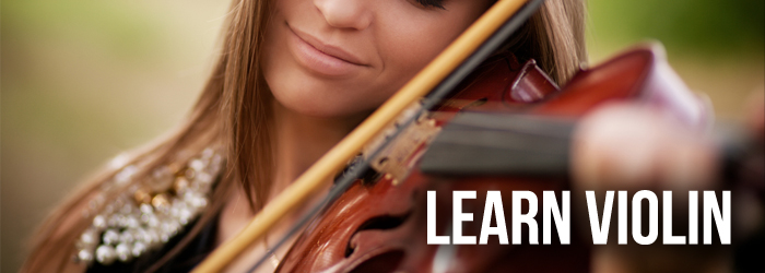 Woman playing violin with her eyes closed