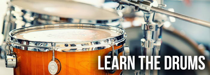 Person playing a drum kit